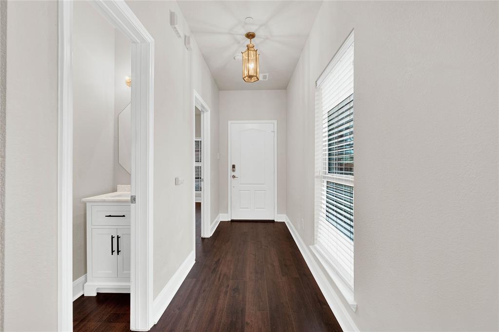 2010 Downing Street Allen, TX 75013 - Photo 6 of 29 a view of a hallway with wooden floor