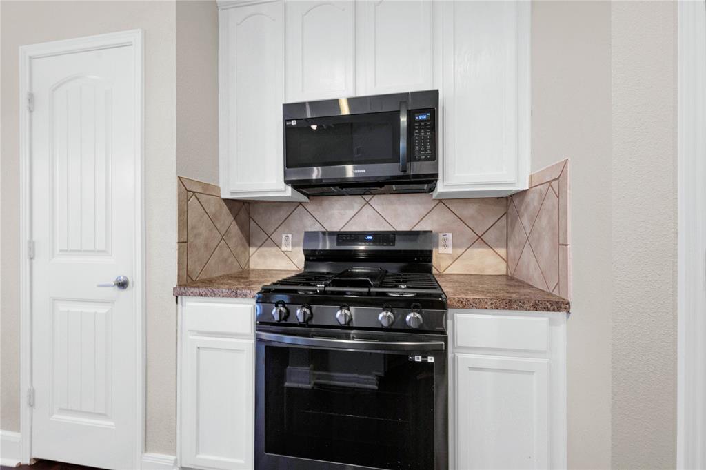 2010 Downing Street Allen, TX 75013 - Photo 10 of 29 a stove top oven sitting inside of a kitchen