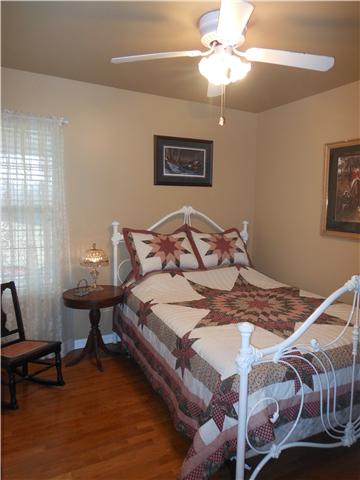 1898 Rock Church Road Charlotte, TN 37036 - Photo 12 of 16 Bedroom 3 with hardwood floors and ceiling fan