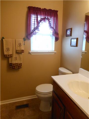 1898 Rock Church Road Charlotte, TN 37036 - Photo 13 of 16 HALL bath with tiled floor, combo tub/shower and linen closet