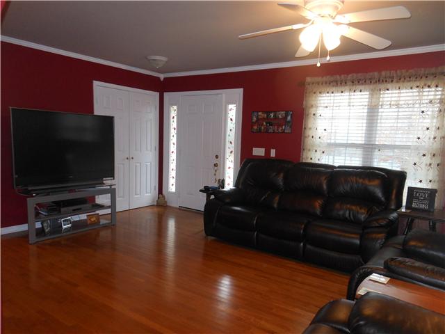1898 Rock Church Road Charlotte, TN 37036 - Photo 7 of 16 Large living room with hardwood floors, ceiling fan and crown molding