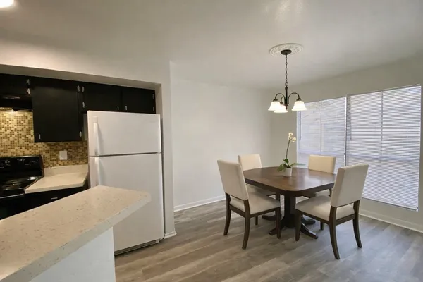 a view of a dining room with furniture