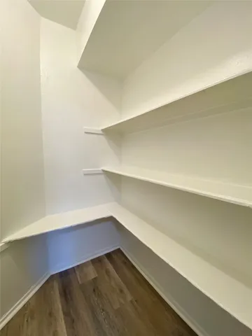 an empty room with a wooden floor