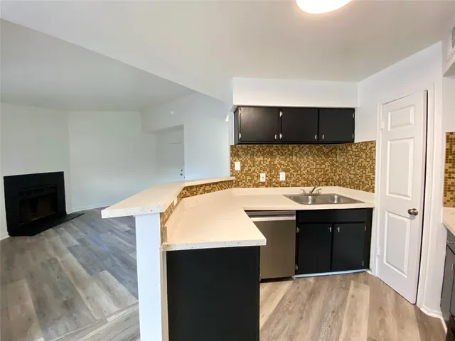 a kitchen with a sink and a stove