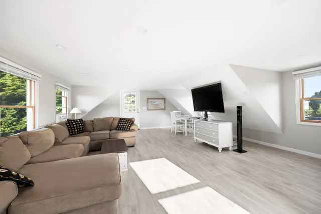 an aerial view of waterside residential houses with outdoor space
