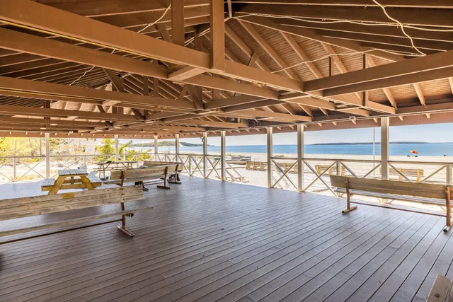 a view of a room with furniture and window