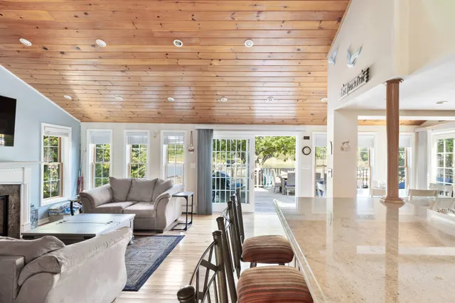 a dining room with furniture and wooden floor