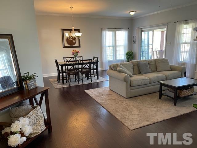 4420 Major Loring Way Raleigh, NC 27616 - Photo 4 of 26 a living room with furniture and wooden floor