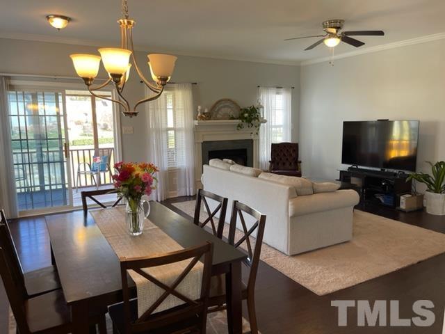 4420 Major Loring Way Raleigh, NC 27616 - Photo 6 of 26 a view of a dining room with furniture and a chandelier