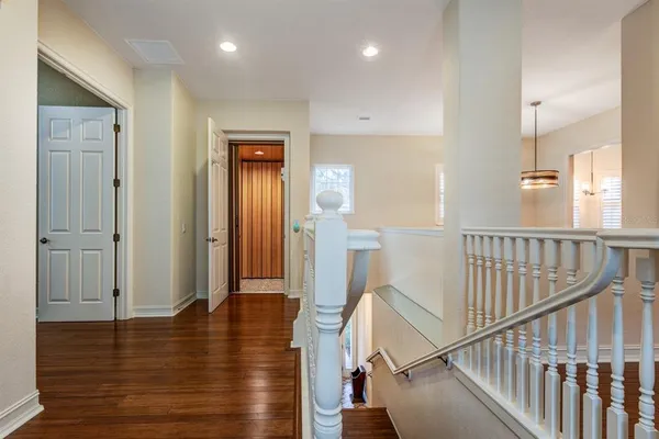 a view of entryway with wooden floor