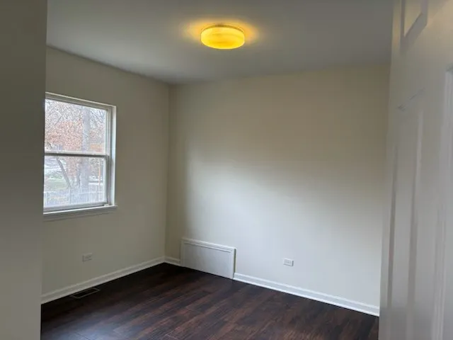 a bathroom with a toilet a sink and shower