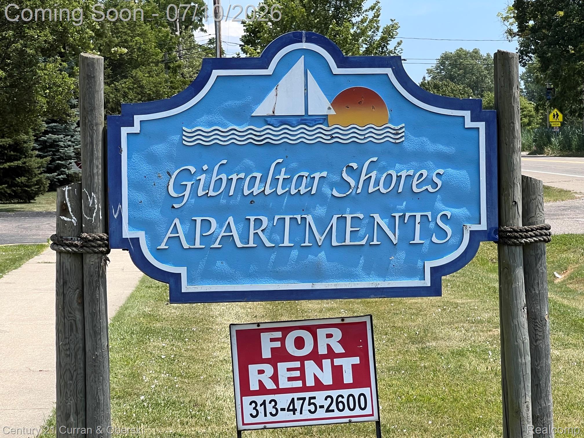 14682 Middle Gibraltar Road, Unit 24 Rockwood, MI 48173 - Photo 21 of 21 Gibraltar Shores Apartments entrance sign featuring a nautical-themed graphic with a sailboat and sunset