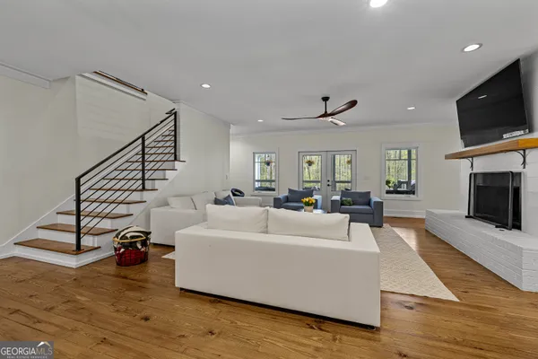 a kitchen with stainless steel appliances granite countertop a kitchen island a stove a table and chairs in it