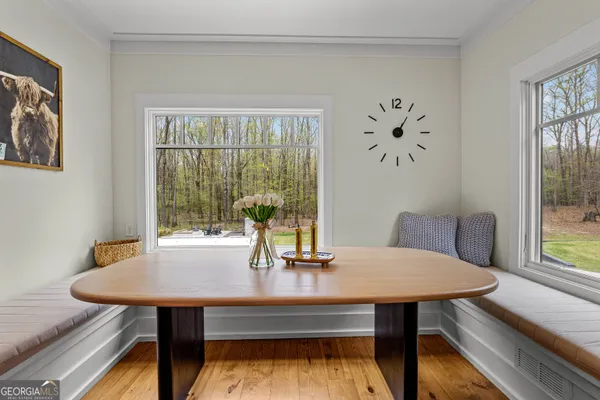 a living room with furniture and a ceiling fan