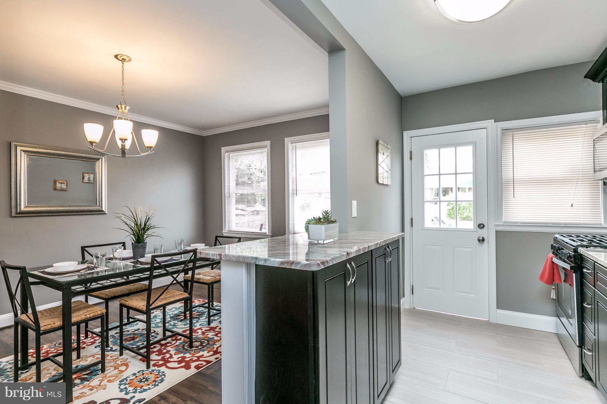 4674 Marble Hall Road Baltimore, MD 21239 - Photo 4 of 29 a view of a kitchen and dining room