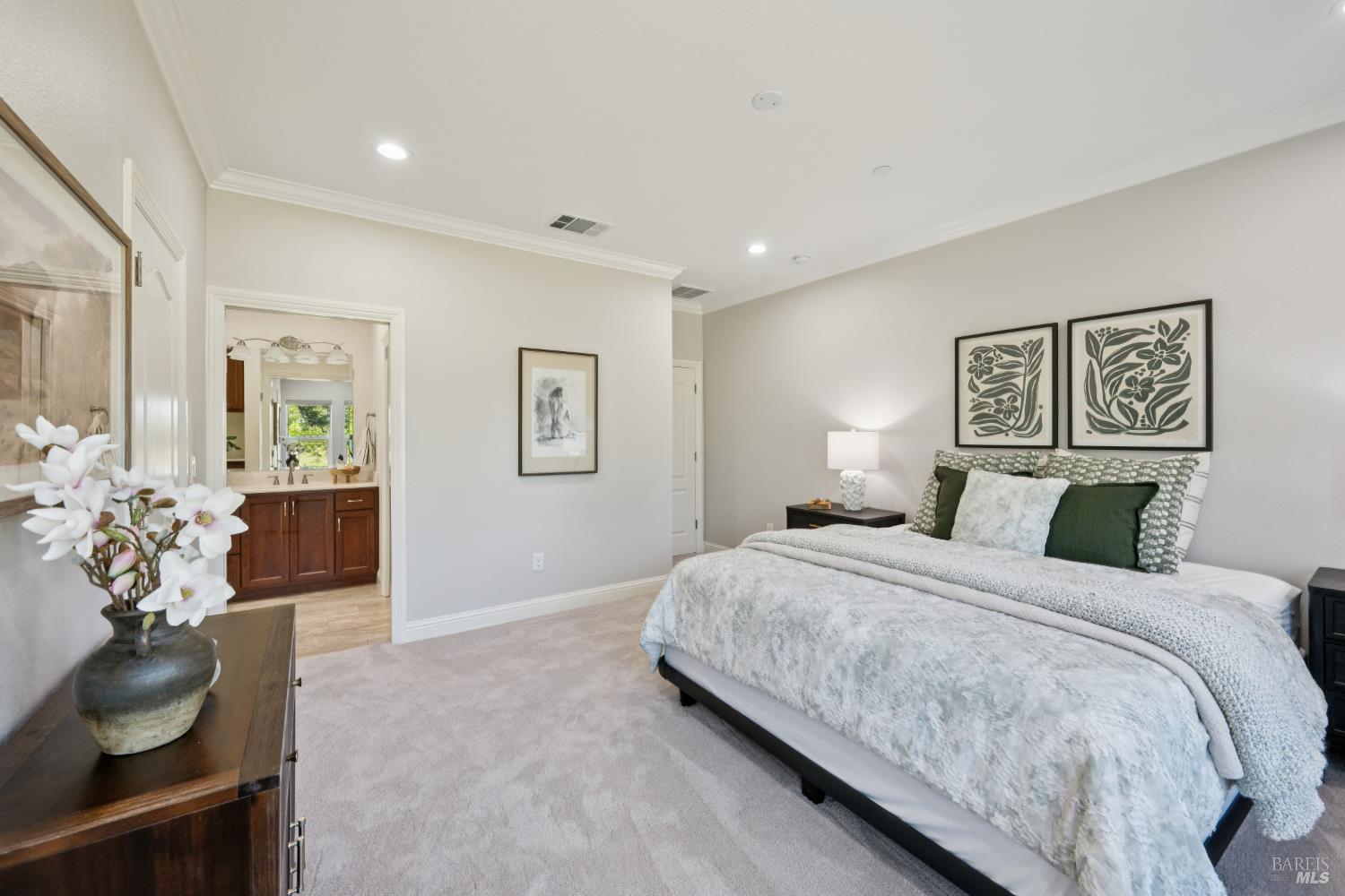 4665 Upper Ridge Road Santa Rosa, CA 95404 - Photo 31 of 71 a bedroom with a large bed and a chandelier