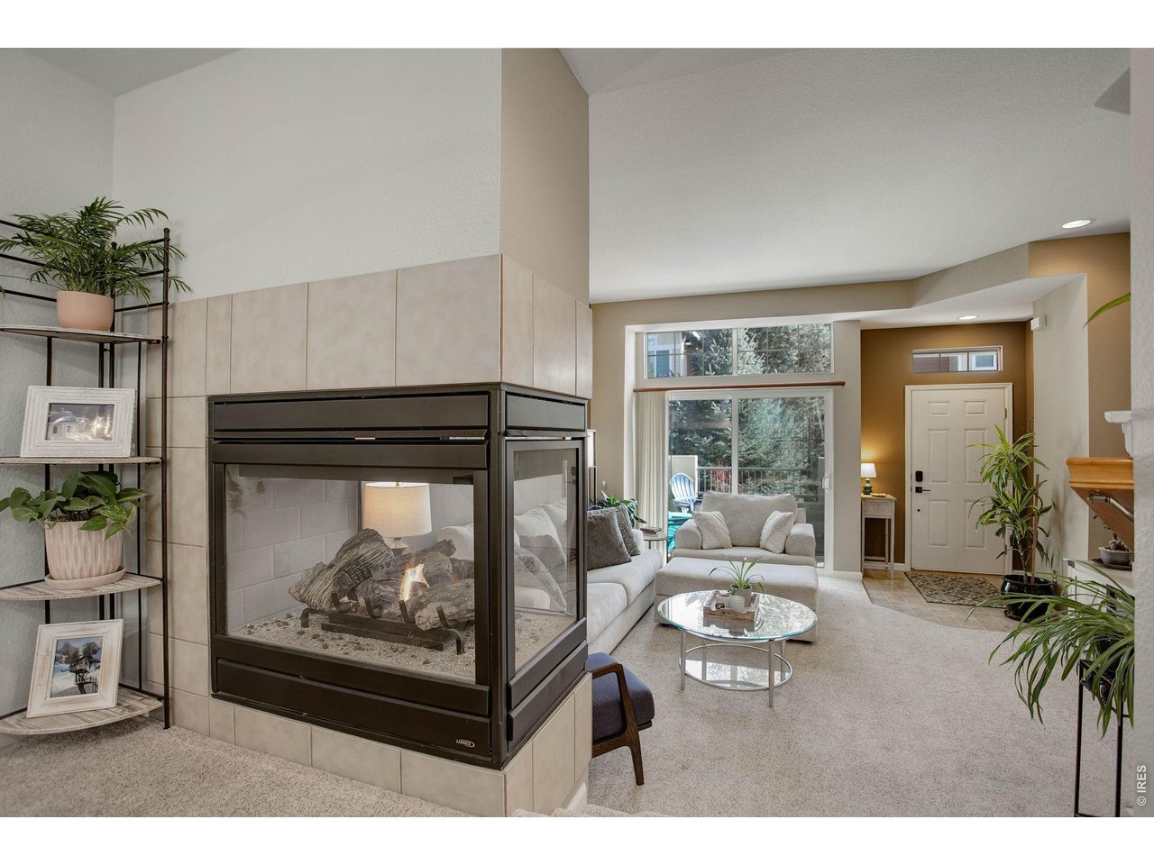 4116 Riley Drive Longmont, CO 80503 - Photo 9 of 33 Double sided gas fireplace visible in both the Living Room and Dining Room