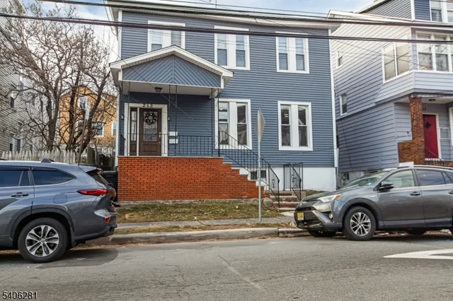 a view of a car parked in front of a house