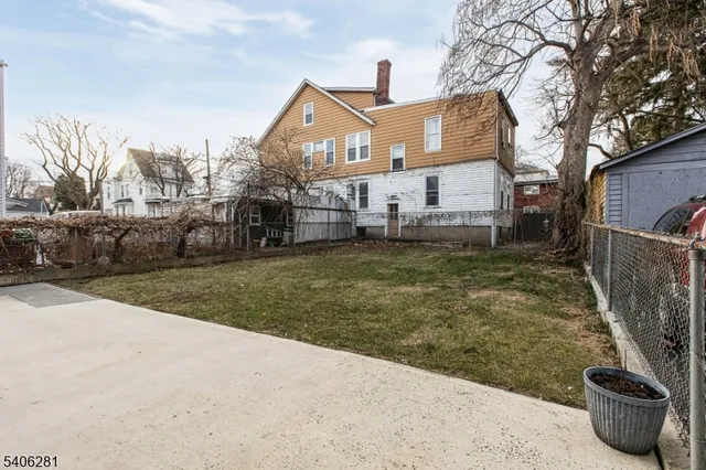 a view of a house with a back yard