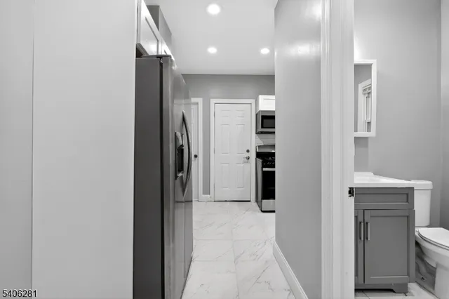a view of a hallway with closet and entryway
