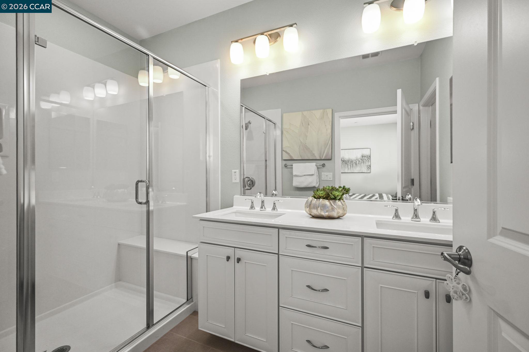 3923 Meridian Street Dublin, CA 94568 - Photo 25 of 39 a bathroom with a double vanity sink mirror and shower