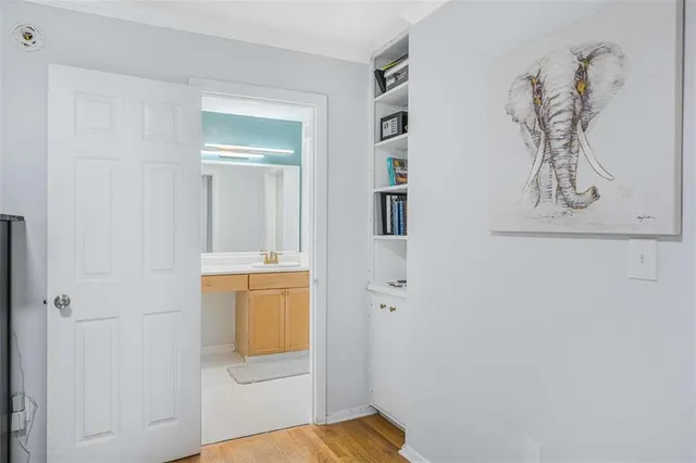 a bathroom with a shower and a sink