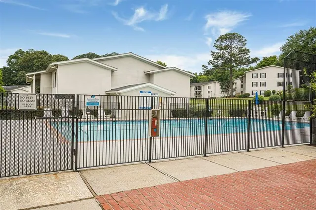 a view of a wrought iron fences in front of house