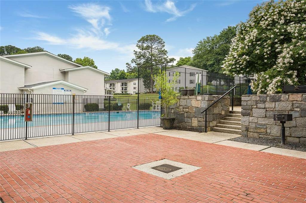 1150 Collier Road Northwest, Unit 25D Atlanta, GA 30318 - Photo 20 of 21 a view of a house with a park