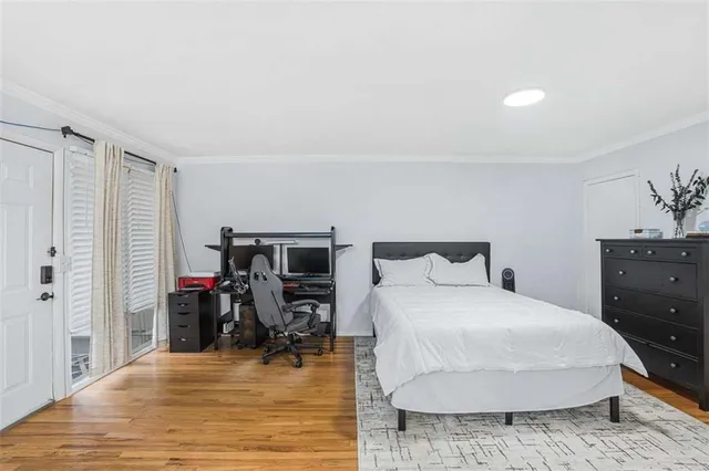 a bedroom with a bed and a table