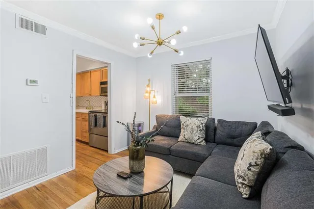a living room with furniture and a table