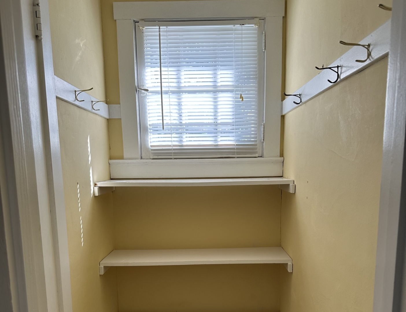 701 Chambers Street Ottawa, IL 61350 - Photo 23 of 32 a view of a room with a window and refrigerator