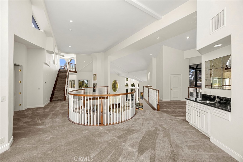 1730 Rocky Road Fullerton, CA 92831 - Photo 49 of 75 Second floor open living area featuring a wet bar, full bathroom, fireplace, dedicated seating space, and two separate viewing rooms.