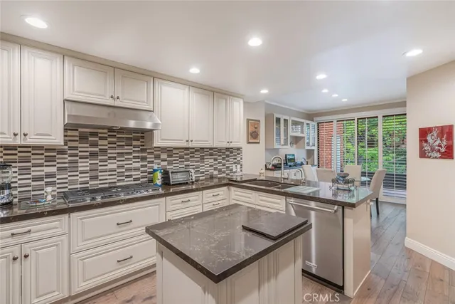 a kitchen with a stove and a sink