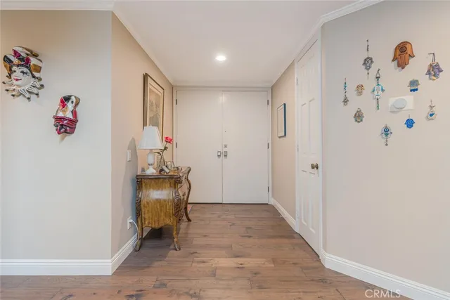 a view of a a dining room with furniture window and wooden floor