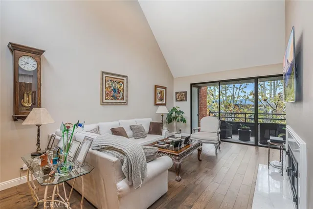 a living room with furniture potted plant and a lamp