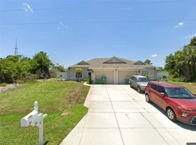 a front view of house with yard outdoor seating and green space
