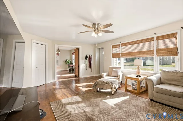 a spacious bedroom with a bed couch and a large window with outer view
