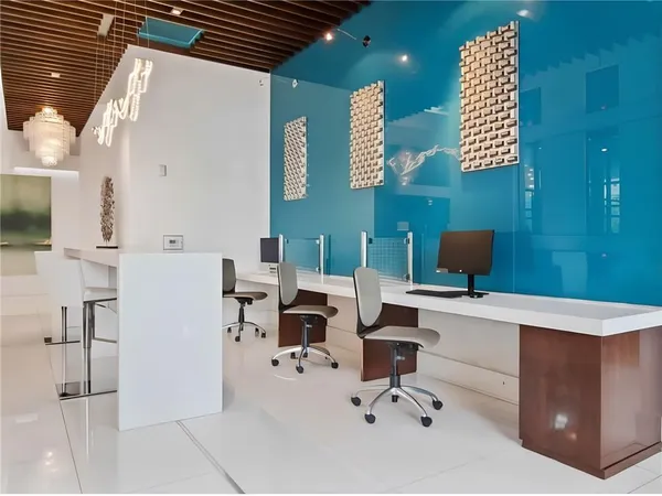 a view of a workspace with furniture