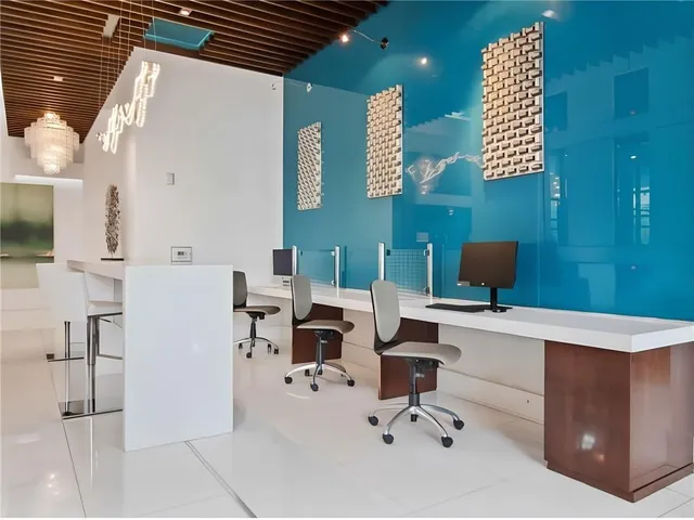 a view of a workspace with furniture