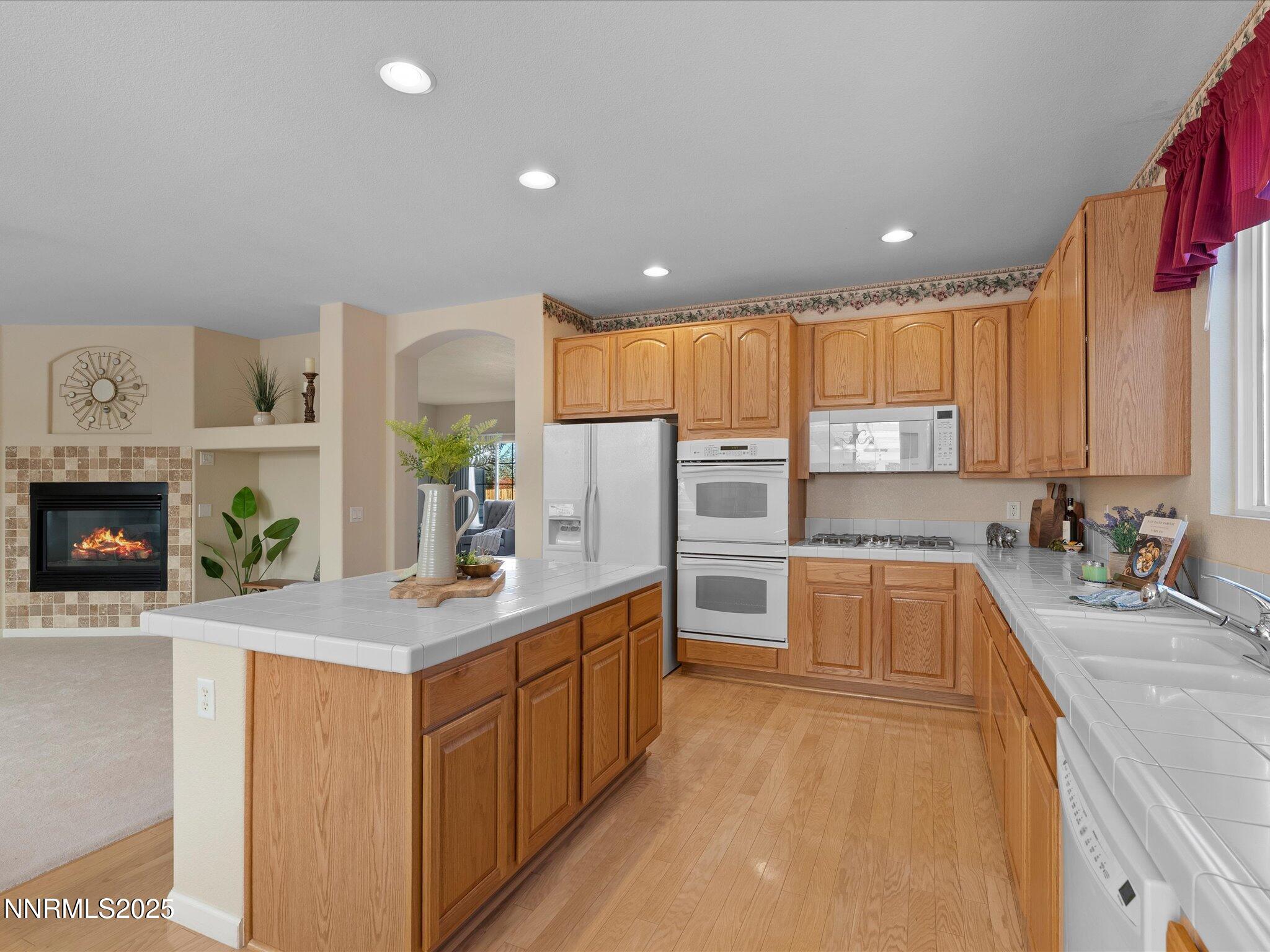 5952 Indus Drive Reno, NV 89502 - Photo 12 of 39 a kitchen with a sink stove and cabinets