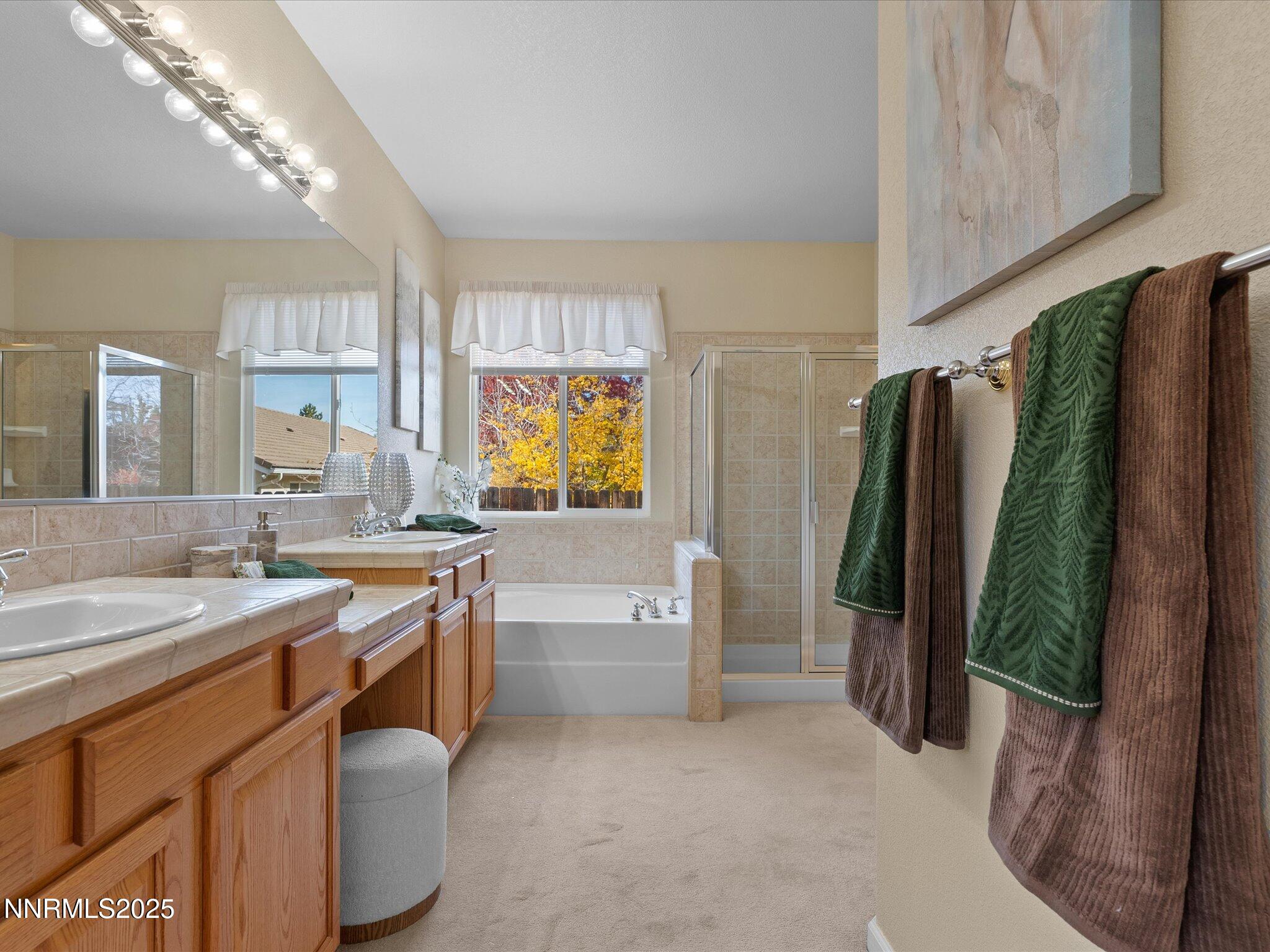 5952 Indus Drive Reno, NV 89502 - Photo 19 of 39 a spacious bathroom with a granite countertop sink and a mirror