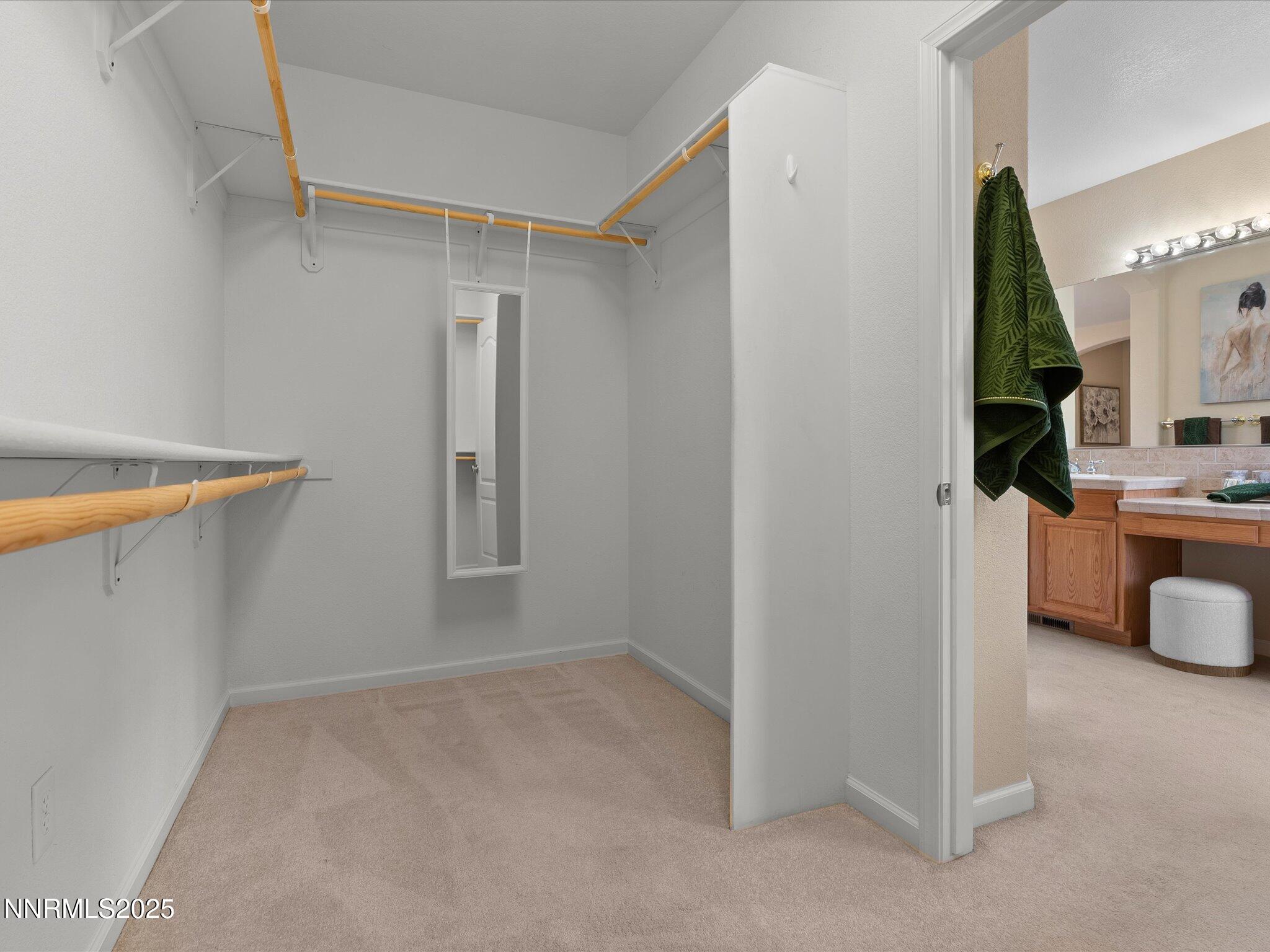 5952 Indus Drive Reno, NV 89502 - Photo 21 of 39 a view of walk in closet with living room