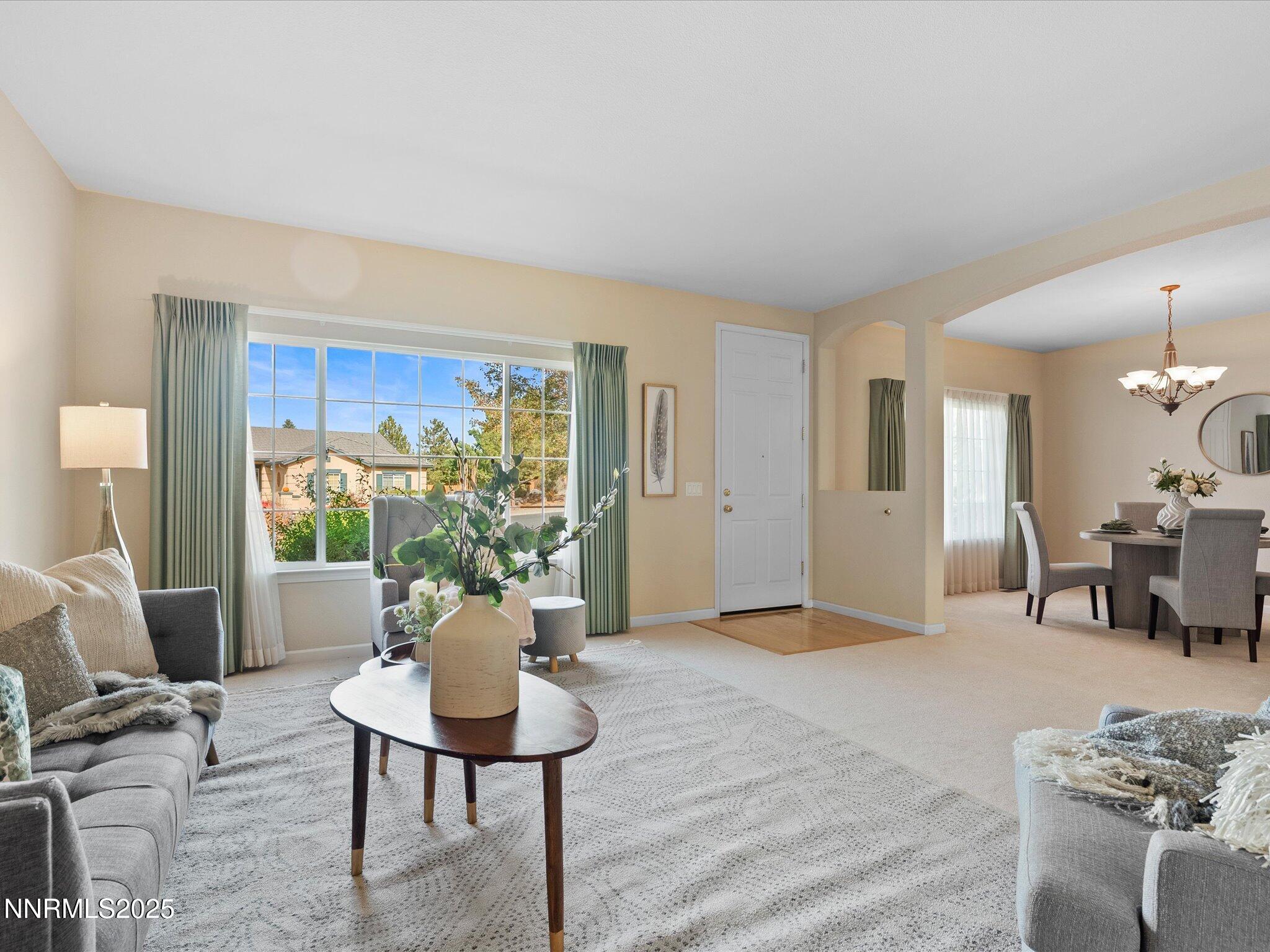 5952 Indus Drive Reno, NV 89502 - Photo 6 of 39 a living room with furniture potted plant and a large window