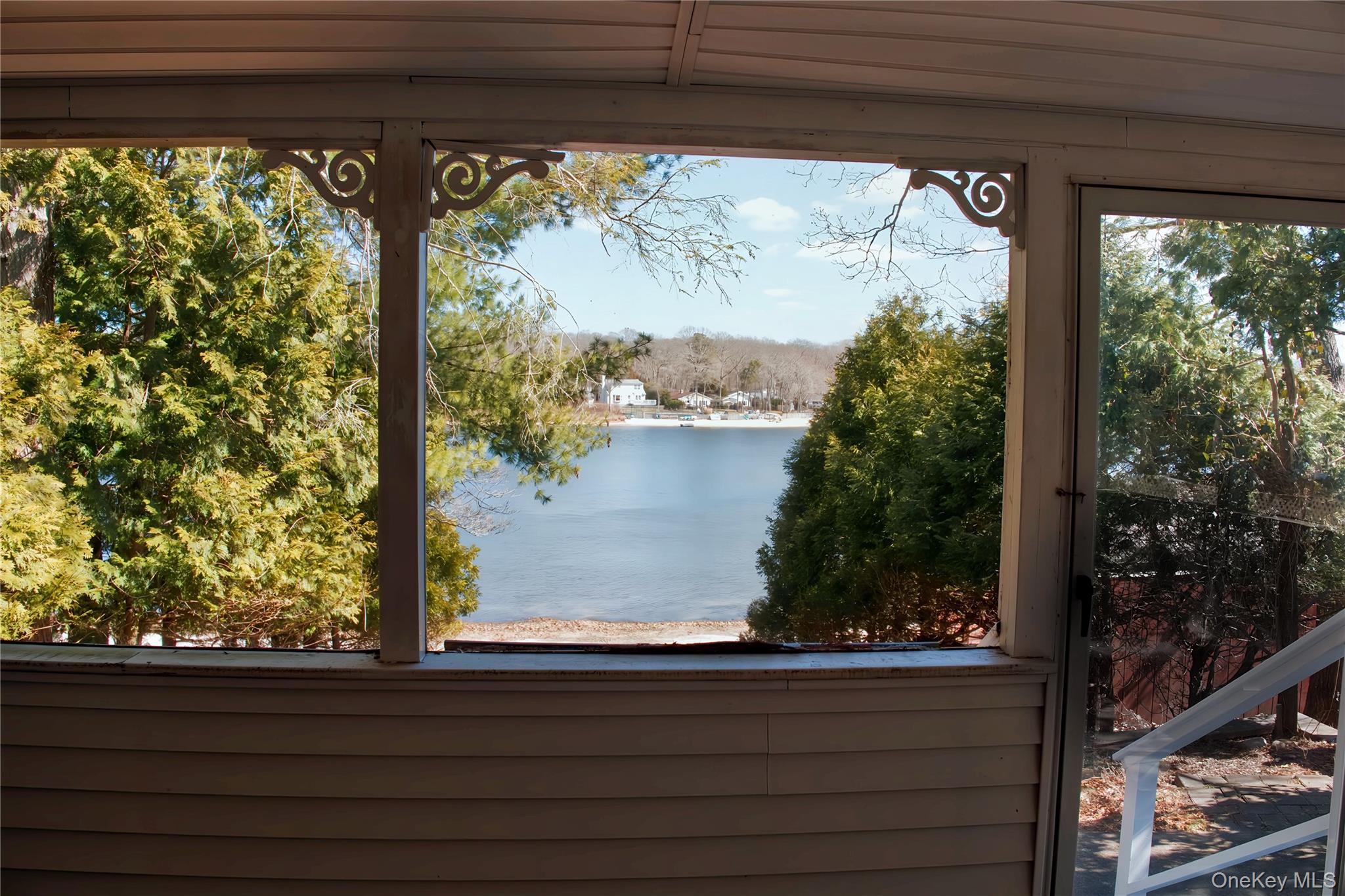 215 Lakeside Trail Ridge, NY 11961 - Photo 14 of 19 a view of lake from a window