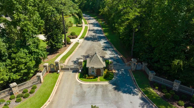 an aerial view of a house with swimming pool