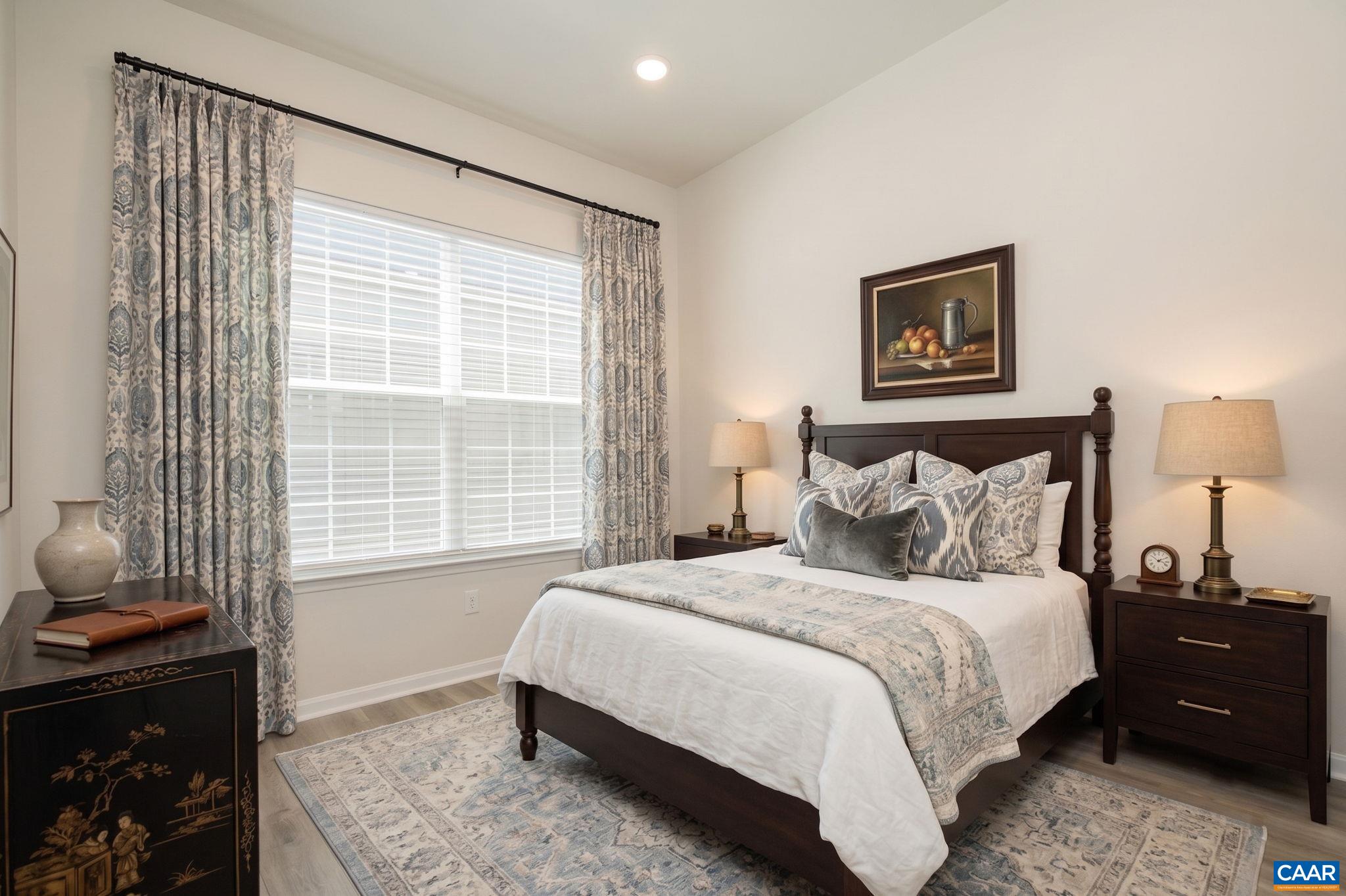 124 Stodghill Drive Ruckersville, VA 22968 - Photo 13 of 58 a bedroom with a bed and a window