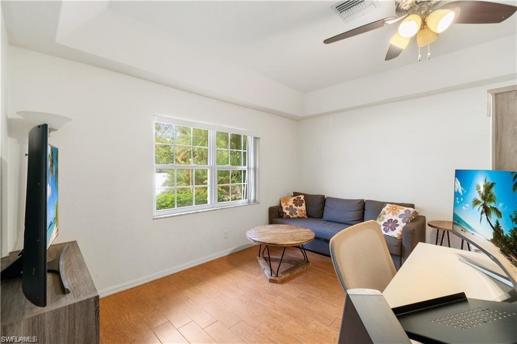 Undisclosed Address Naples, FL 34110 - Photo 12 of 19 a living room with furniture and a window