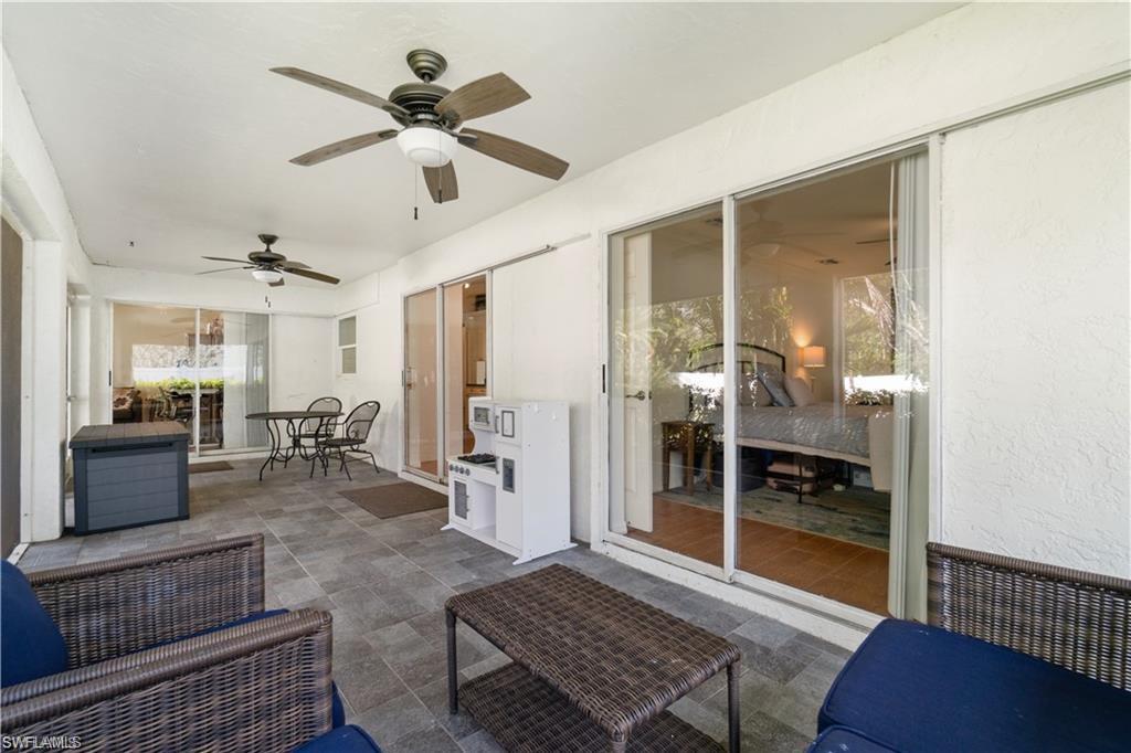 Undisclosed Address Naples, FL 34110 - Photo 13 of 19 a living room with furniture and wooden floor