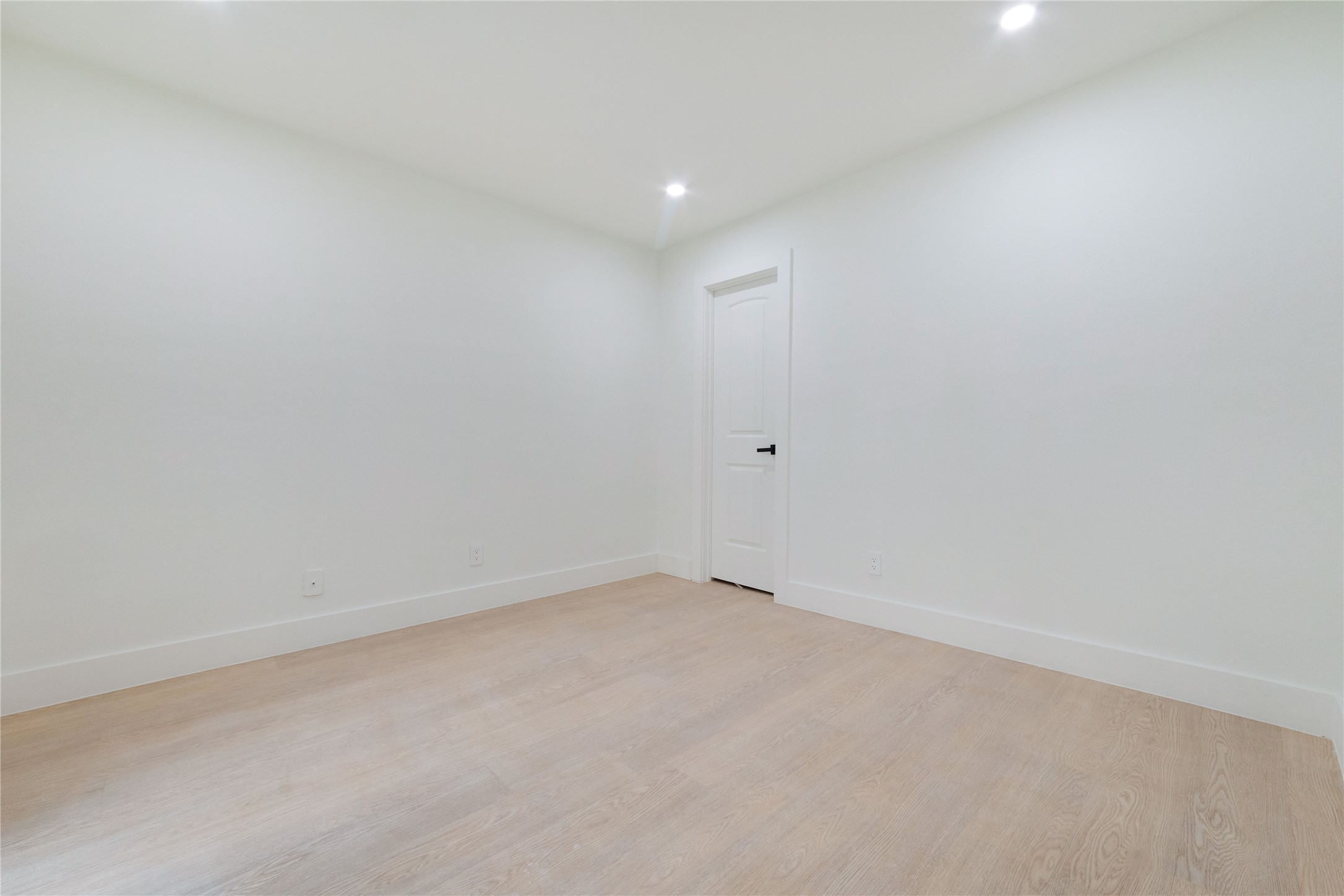 8807 Merion Circle Austin, TX 78754 - Photo 9 of 18 A spacious room offers light-toned flooring and recessed lighting, ready for personalization.
