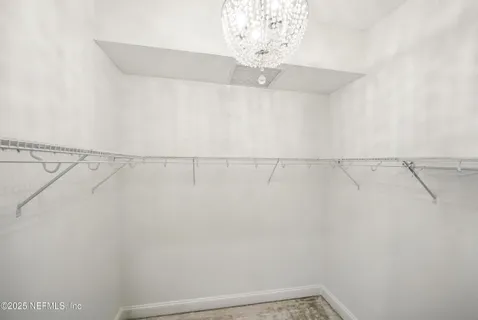 a bathroom with a sink shower and a mirror